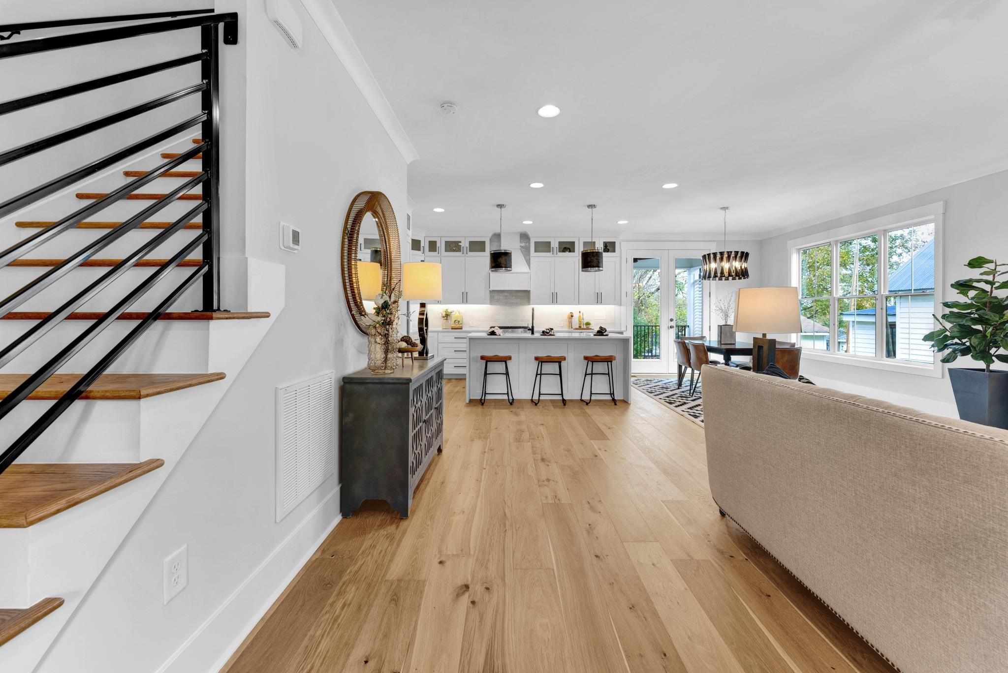 114 Summit Avenue Raleigh, NC 27603 - Photo 3 of 62 a living room with furniture and a chandelier