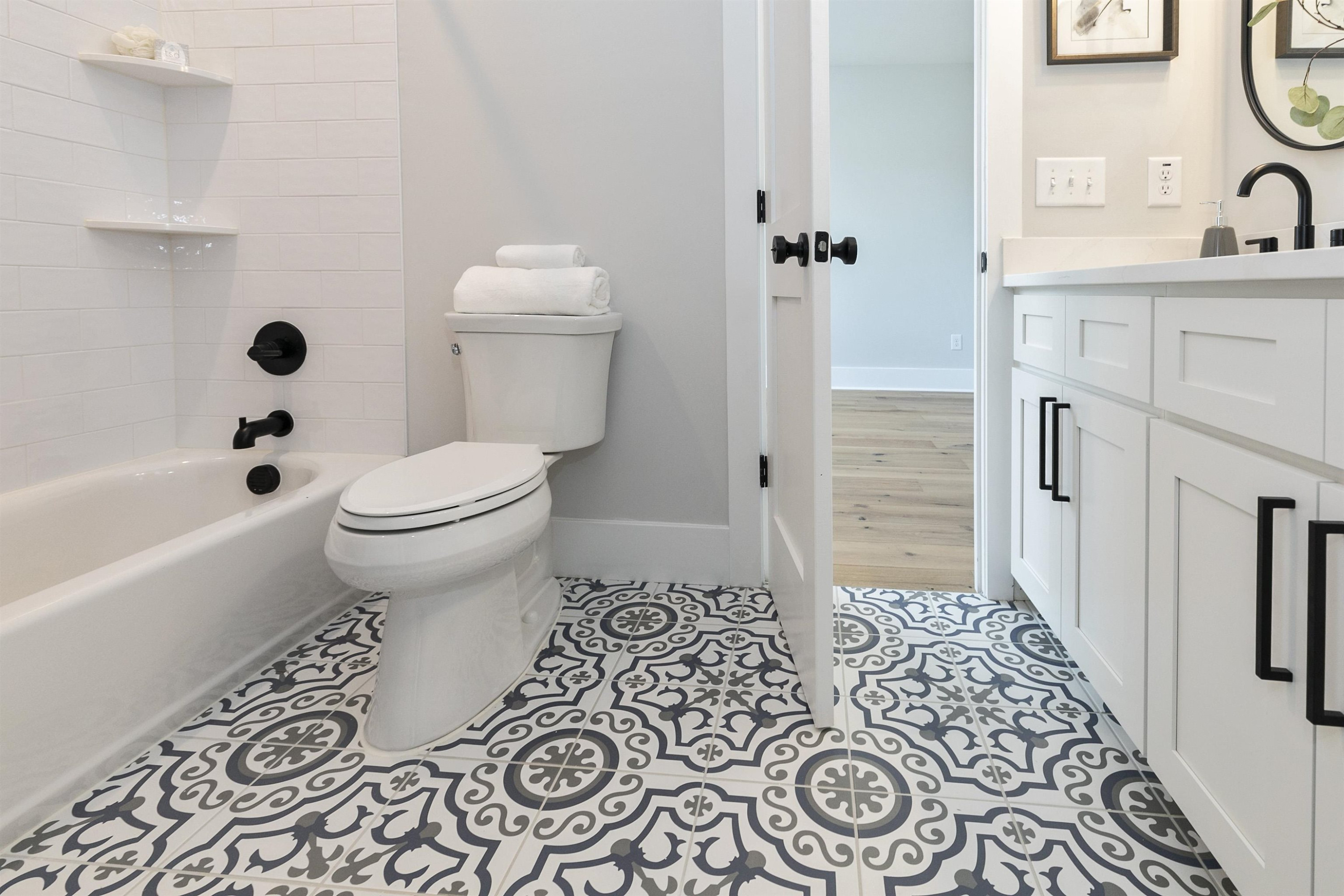 114 Summit Avenue Raleigh, NC 27603 - Photo 35 of 62 a bathroom with a sink toilet and shower