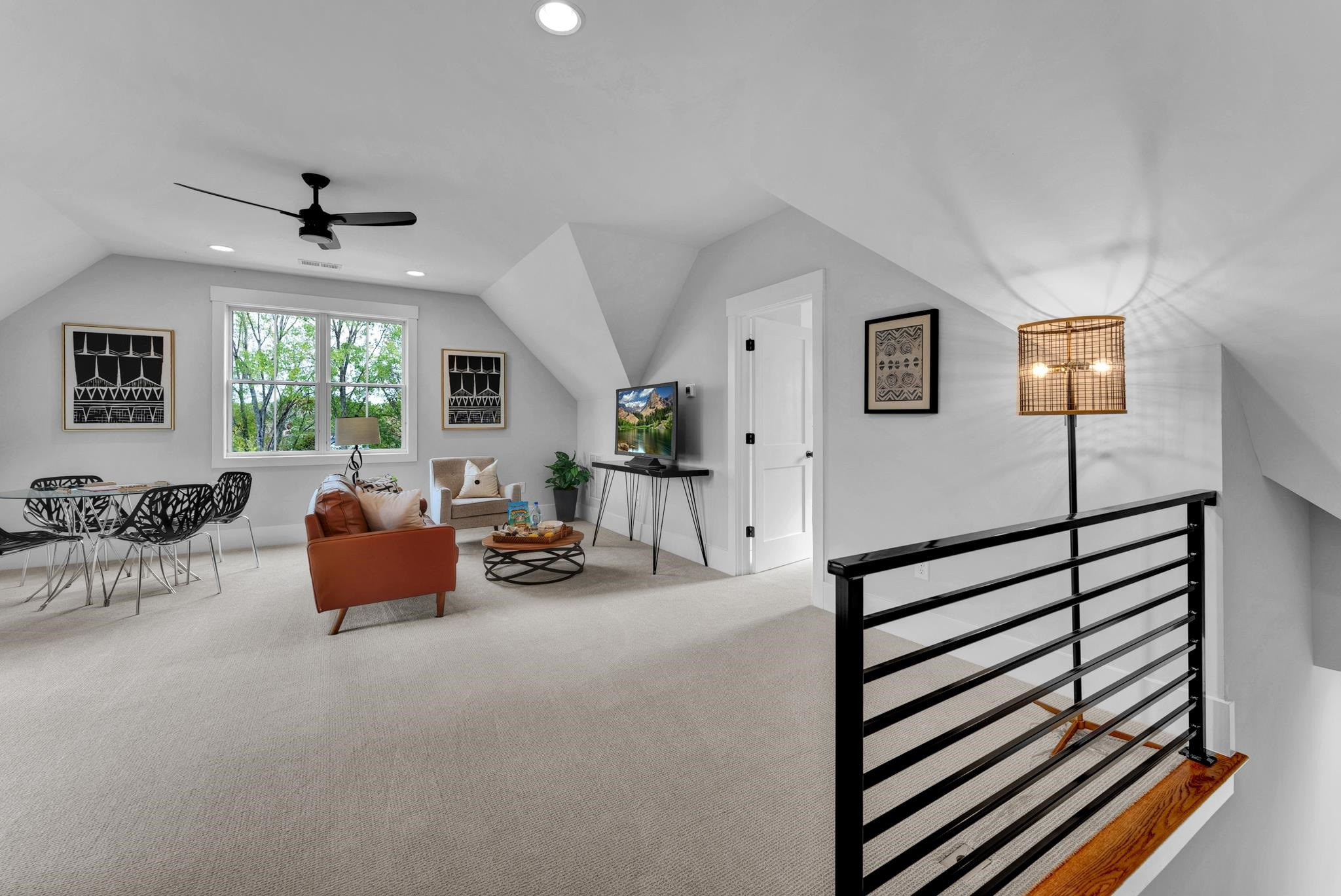 114 Summit Avenue Raleigh, NC 27603 - Photo 40 of 62 a living room with furniture and a chandelier