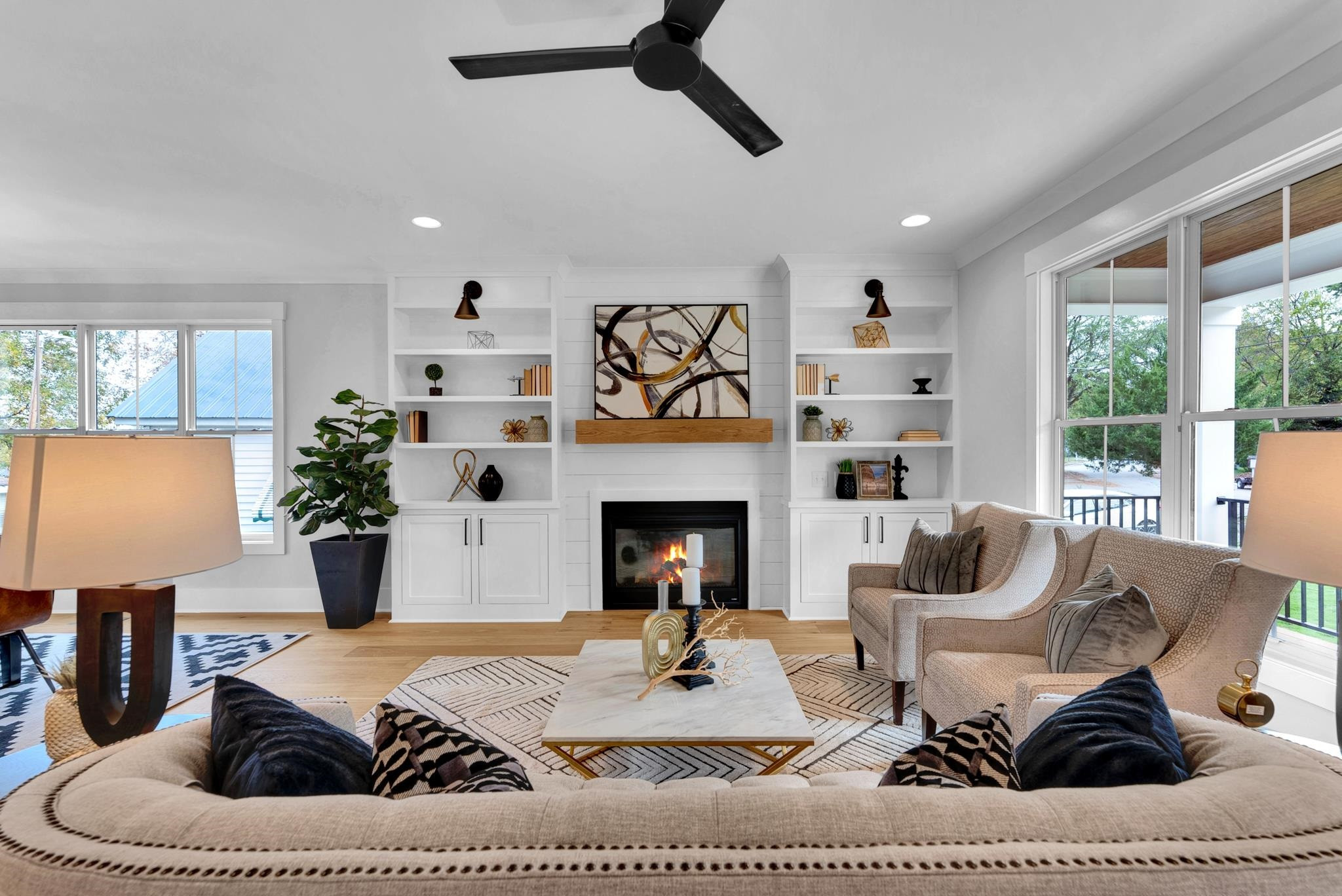 114 Summit Avenue Raleigh, NC 27603 - Photo 4 of 62 a living room with furniture a fireplace and a large mirror