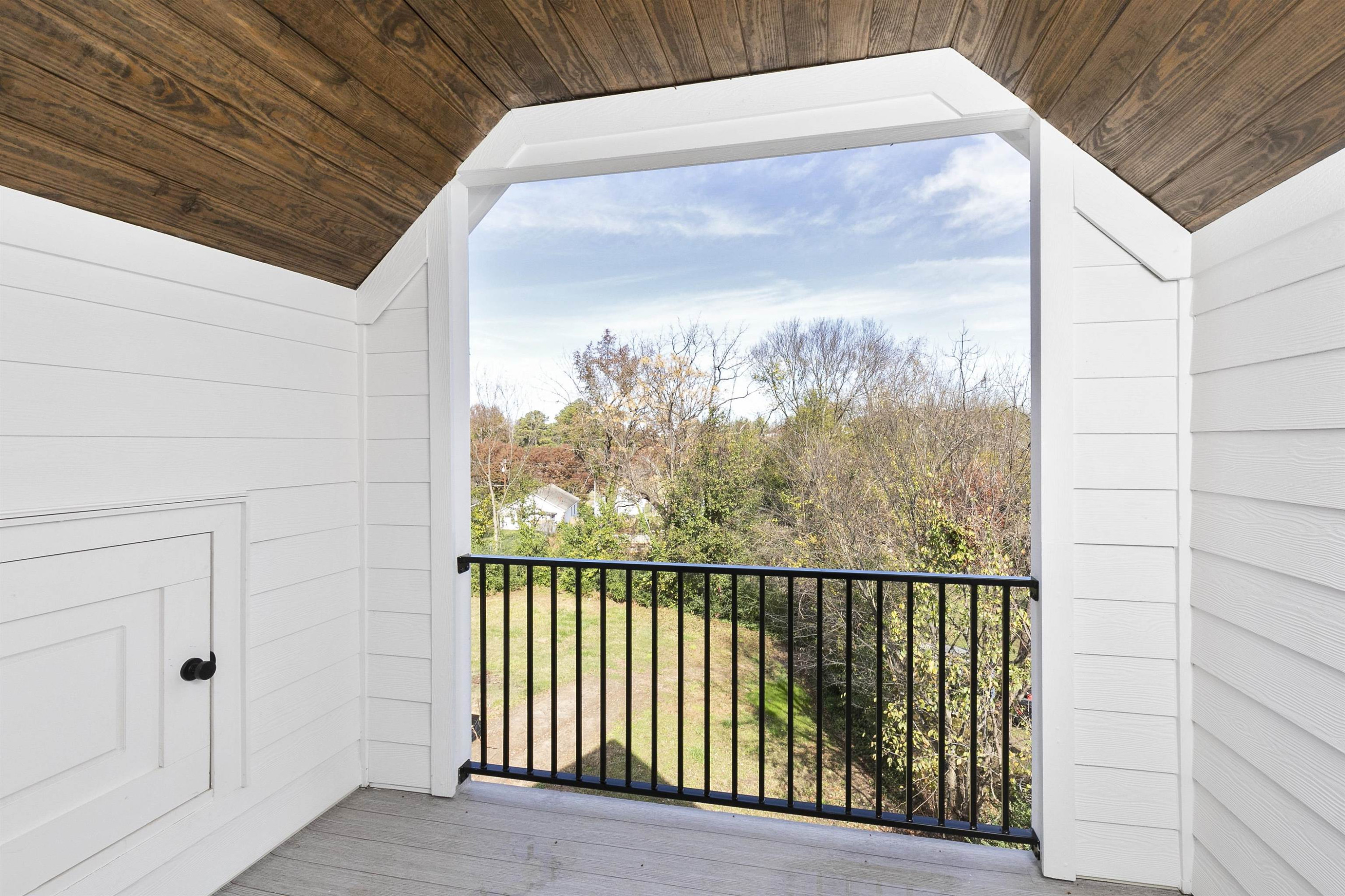 114 Summit Avenue Raleigh, NC 27603 - Photo 42 of 62 a view of a glass door with a roof deck