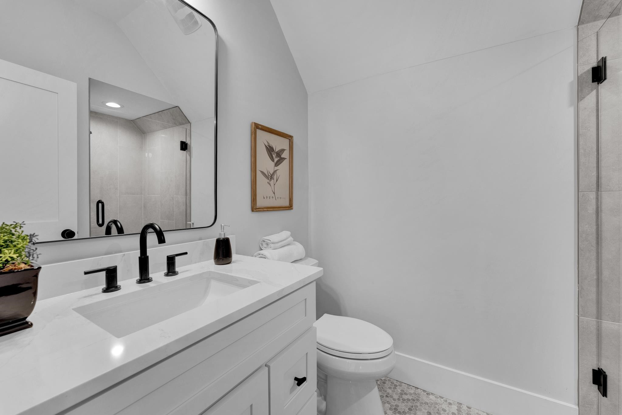 114 Summit Avenue Raleigh, NC 27603 - Photo 47 of 62 a bathroom with a sink mirror vanity and toilet