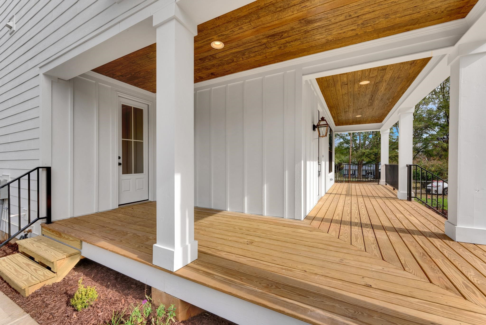 114 Summit Avenue Raleigh, NC 27603 - Photo 54 of 62 a view of a balcony with wooden floor