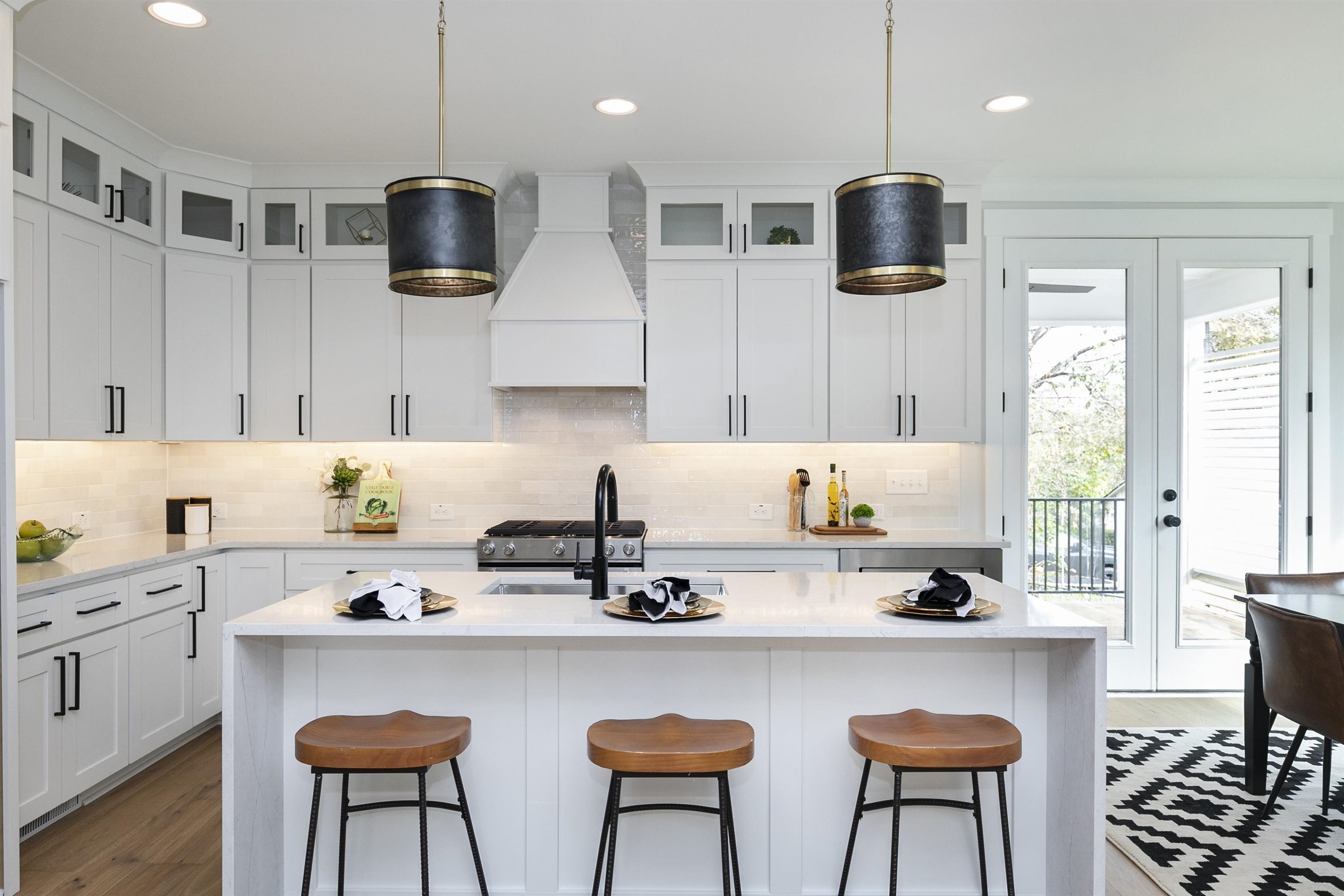 114 Summit Avenue Raleigh, NC 27603 - Photo 9 of 62 a kitchen with stainless steel appliances a stove a sink a microwave and wooden cabinets