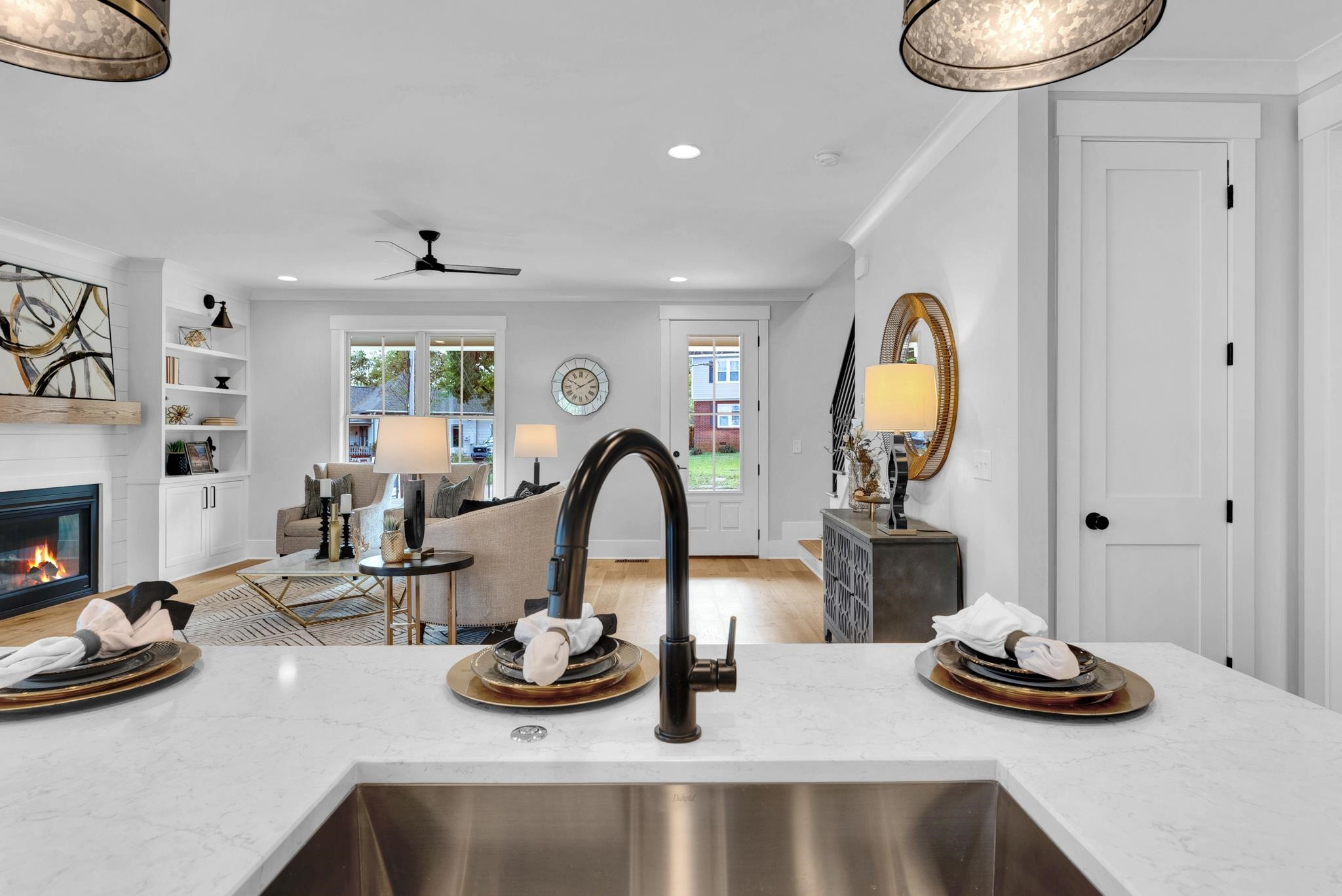 114 Summit Avenue Raleigh, NC 27603 - Photo 10 of 62 a kitchen with a sink a stove and a wooden floor