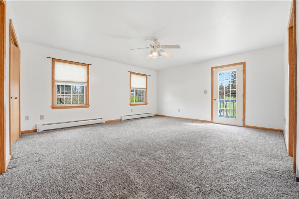 10486 Mohawk Road Conneaut Lake, PA 16316 - Photo 22 of 35 a view of an empty room with a window and a ceiling fan