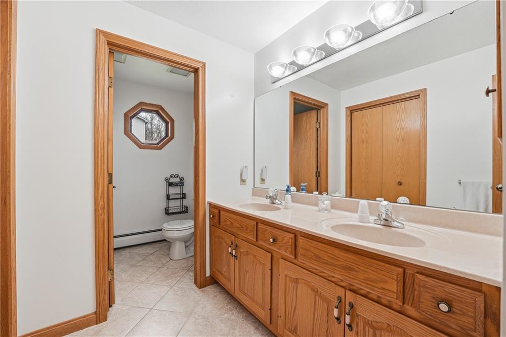 10486 Mohawk Road Conneaut Lake, PA 16316 - Photo 24 of 35 a bathroom with a sink and a mirror