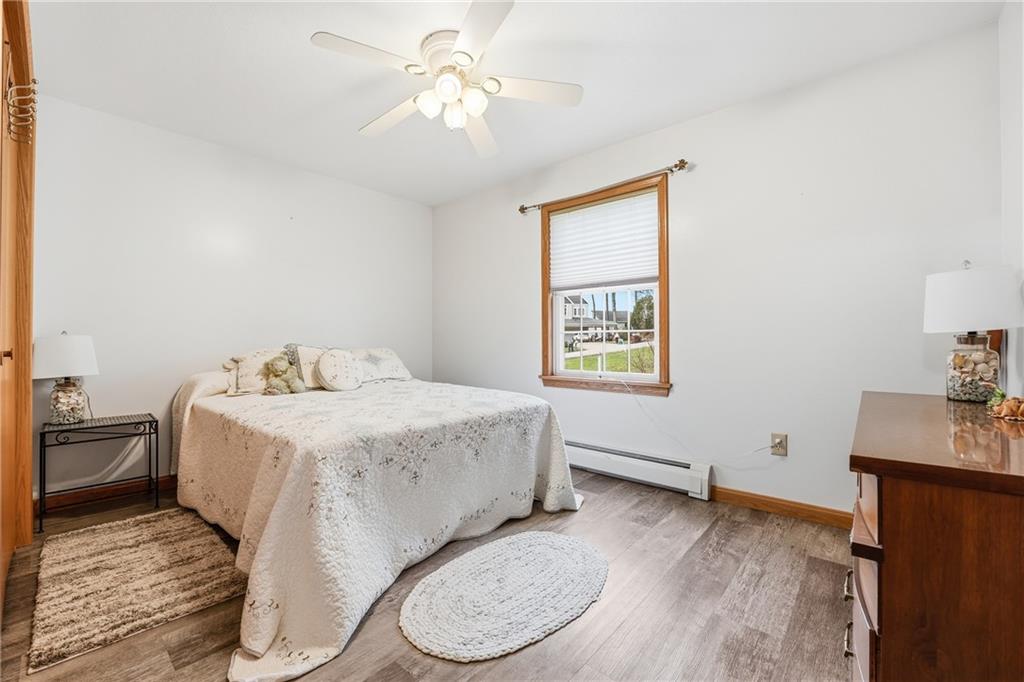 10486 Mohawk Road Conneaut Lake, PA 16316 - Photo 26 of 35 a spacious bedroom with a bed and a window