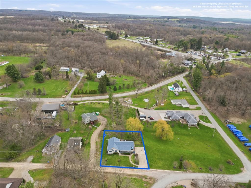 10486 Mohawk Road Conneaut Lake, PA 16316 - Photo 35 of 35 an aerial view of residential houses with outdoor space and trees