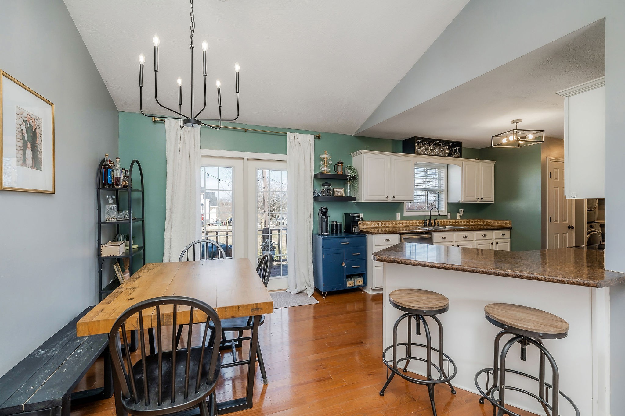 1630 Blackburn Fork Road Cookeville, TN 38501 - Photo 17 of 30 a kitchen with stainless steel appliances kitchen island granite countertop a dining table chairs refrigerator and sink