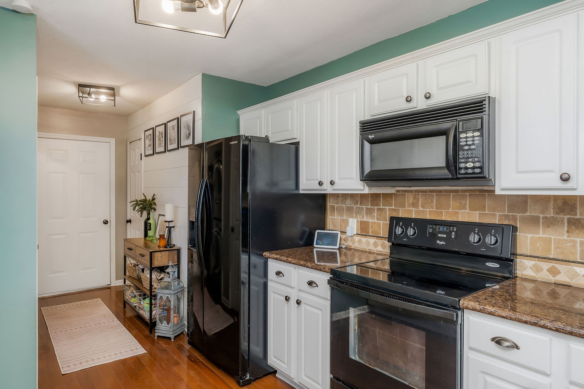 1630 Blackburn Fork Road Cookeville, TN 38501 - Photo 19 of 30 a kitchen with a refrigerator stove and cabinets