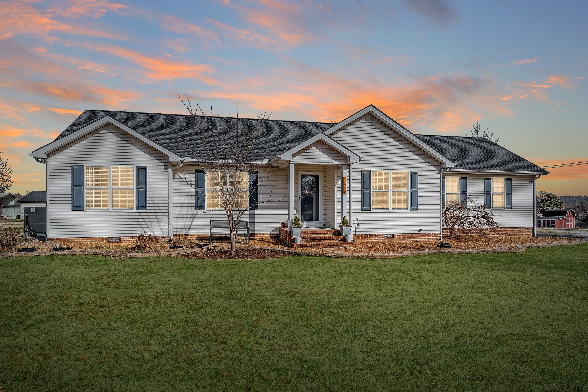 1630 Blackburn Fork Road Cookeville, TN 38501 - Photo 28 of 30 a front view of a house with patio and yard