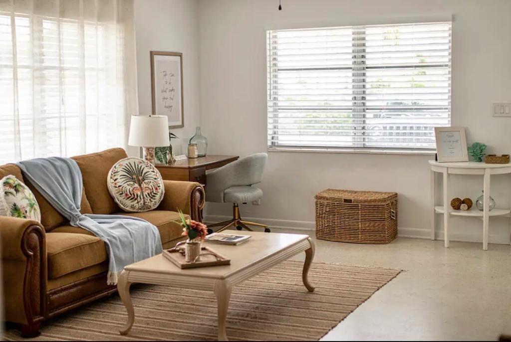 3232 Northeast 15th Street Pompano Beach, FL 33062 - Photo 2 of 16 a living room with furniture and a window