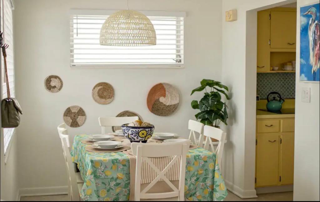 3232 Northeast 15th Street Pompano Beach, FL 33062 - Photo 5 of 16 a view of dining room and kitchen with windows