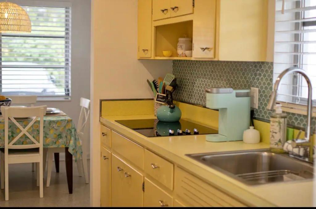 3232 Northeast 15th Street Pompano Beach, FL 33062 - Photo 6 of 16 a kitchen with a sink and granite top