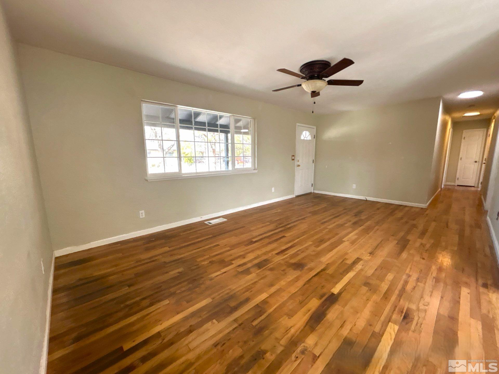 25 Comstock Drive Fernley, NV 89408 - Photo 3 of 10 a view of an empty room with a window