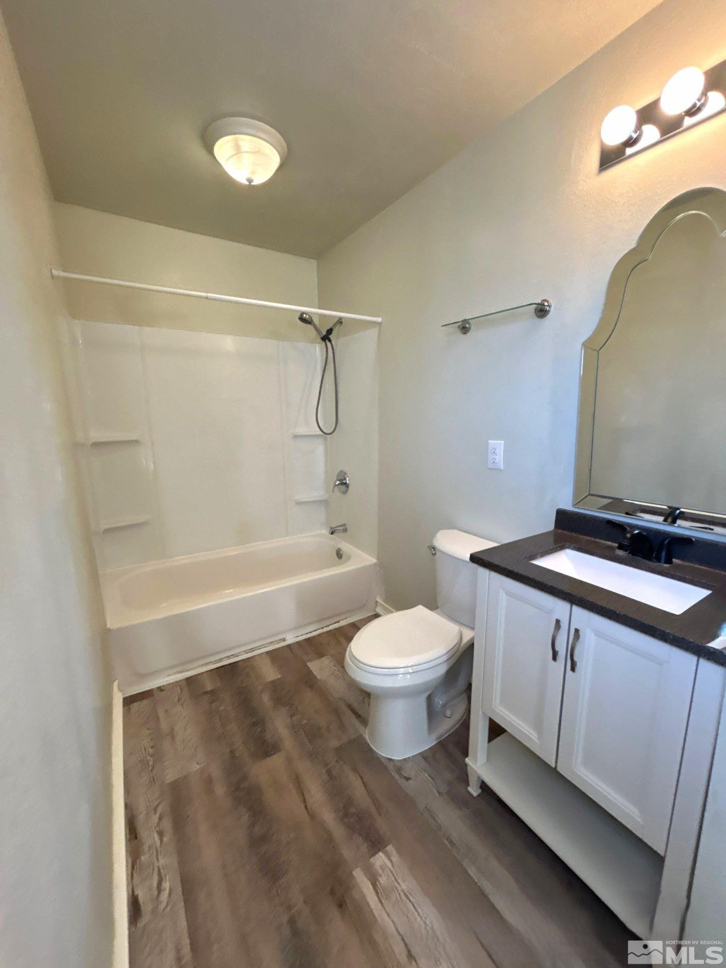 25 Comstock Drive Fernley, NV 89408 - Photo 7 of 10 a bathroom with a sink a toilet and shower
