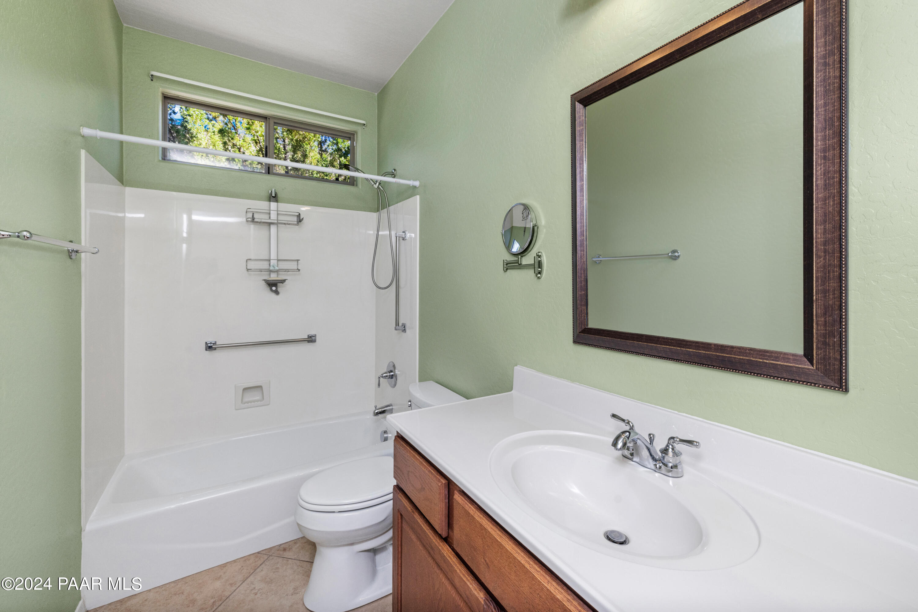 1195 Rigo Ranch Road Prescott Valley, AZ 86314 - Photo 14 of 65 a bathroom with a sink a toilet and shower