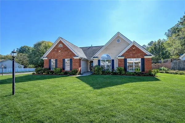 a front view of a house with a yard