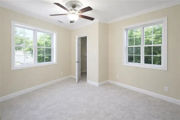 a view of an empty room with a window