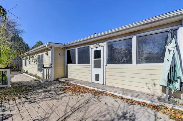 a view of a house with a backyard