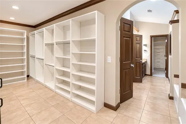 a view of a entryway door with hallway in a room