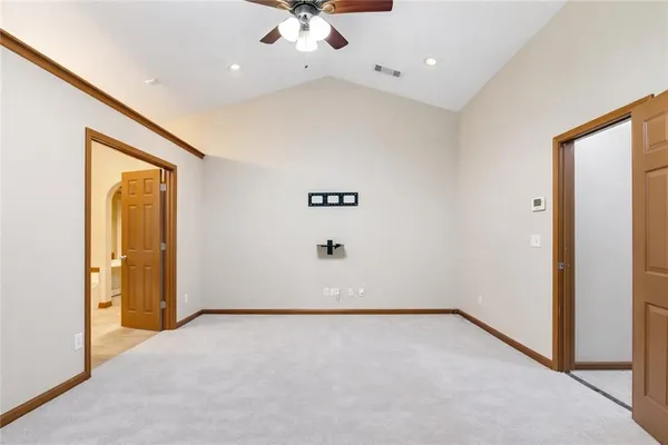 an empty room with a empty space and windows