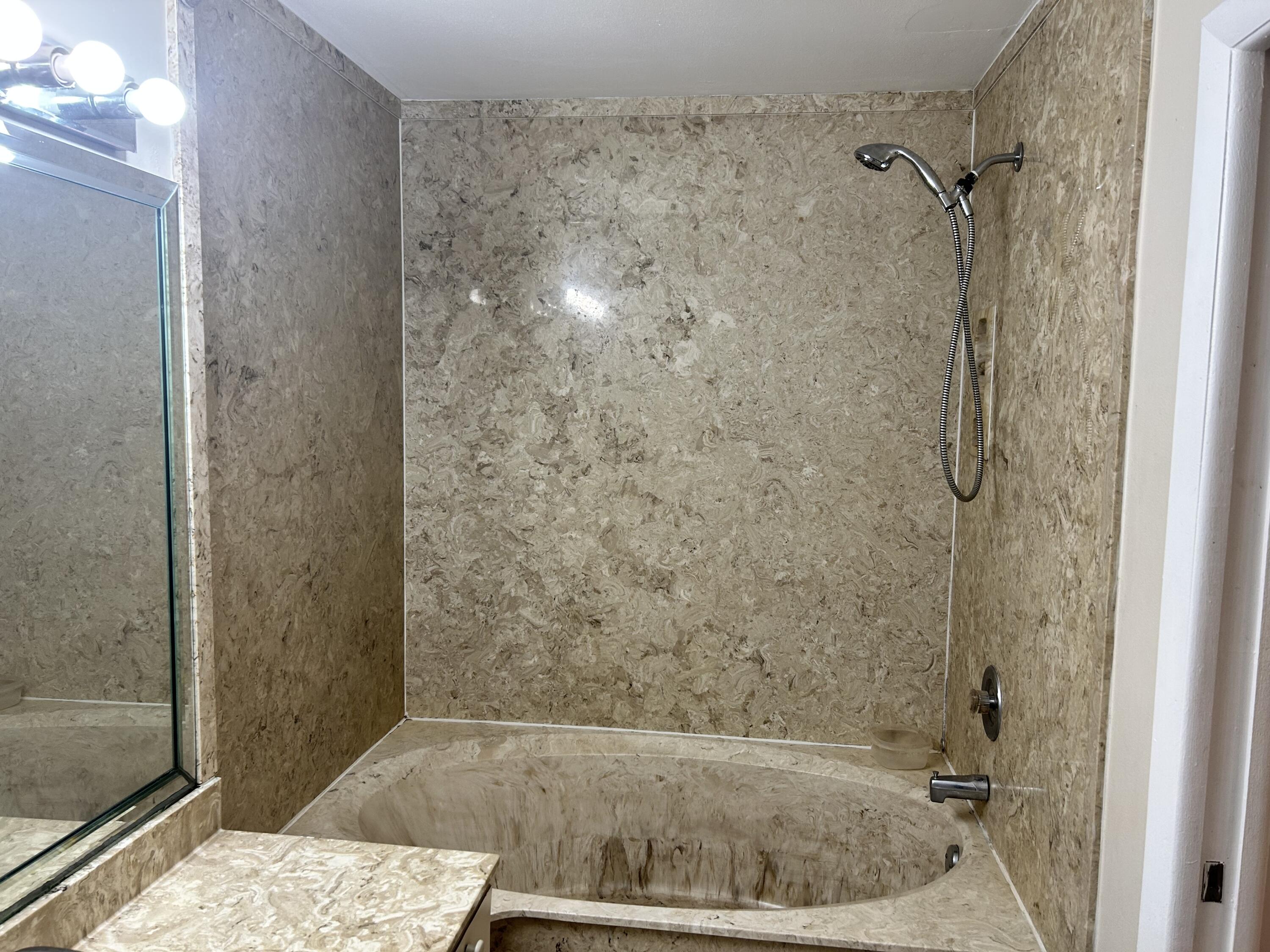23 Crossings Circle, Unit E Boynton Beach, FL 33435 - Photo 12 of 19 a bathroom with a shower