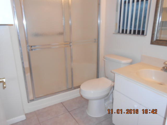 23 Crossings Circle, Unit E Boynton Beach, FL 33435 - Photo 3 of 19 a bathroom with a sink and toilet