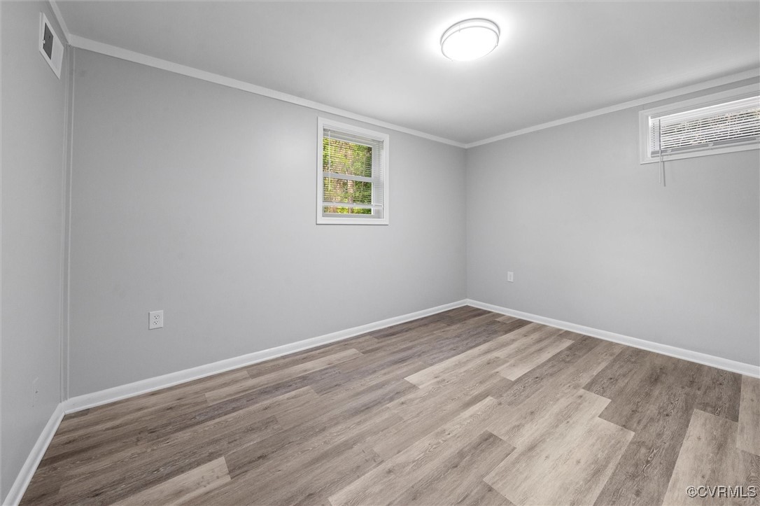 3425 Newbys Bridge Road Chesterfield, VA 23832 - Photo 29 of 49 Empty room featuring wood finished floors, visible