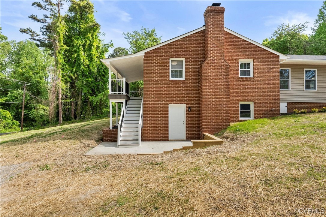 3425 Newbys Bridge Road Chesterfield, VA 23832 - Photo 34 of 49 Back of house with a chimney, a yard, and stairs