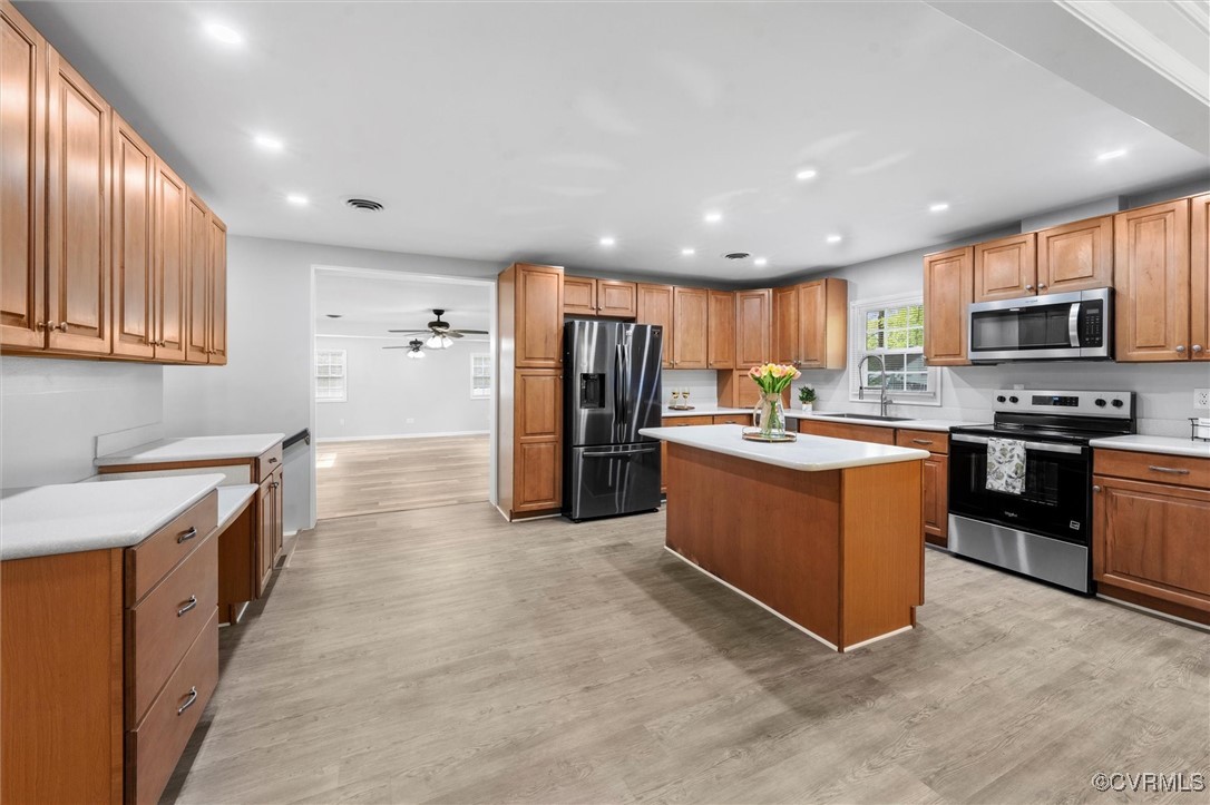3425 Newbys Bridge Road Chesterfield, VA 23832 - Photo 10 of 49 Kitchen with light wood-style flooring, stainless
