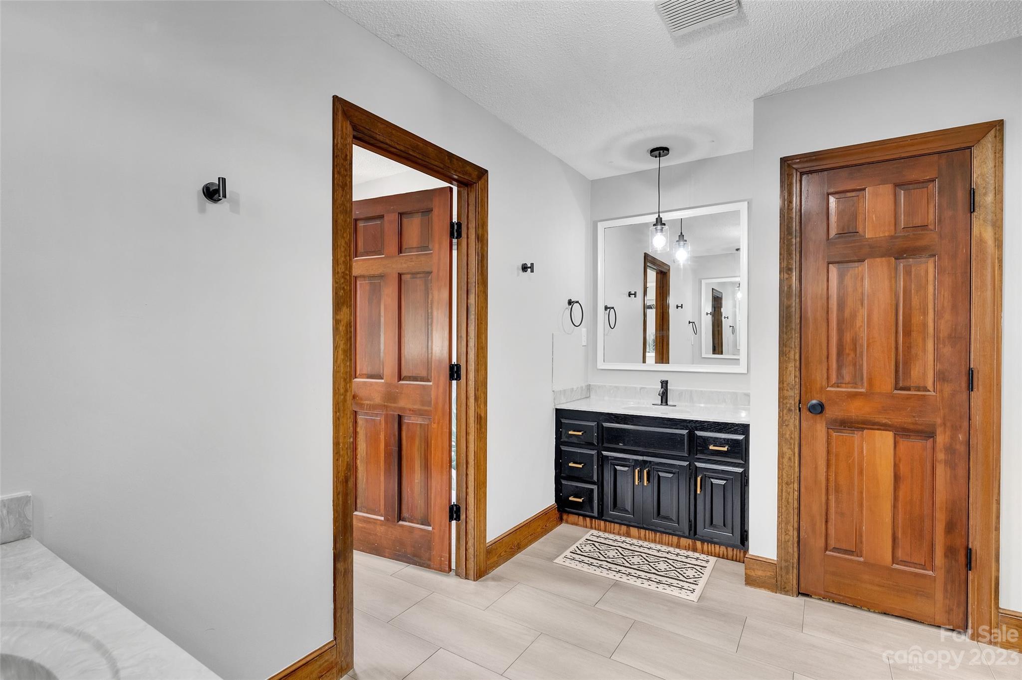 700 West Zion Church Road Shelby, NC 28150 - Photo 29 of 45 a spacious bathroom with a sink and a mirror