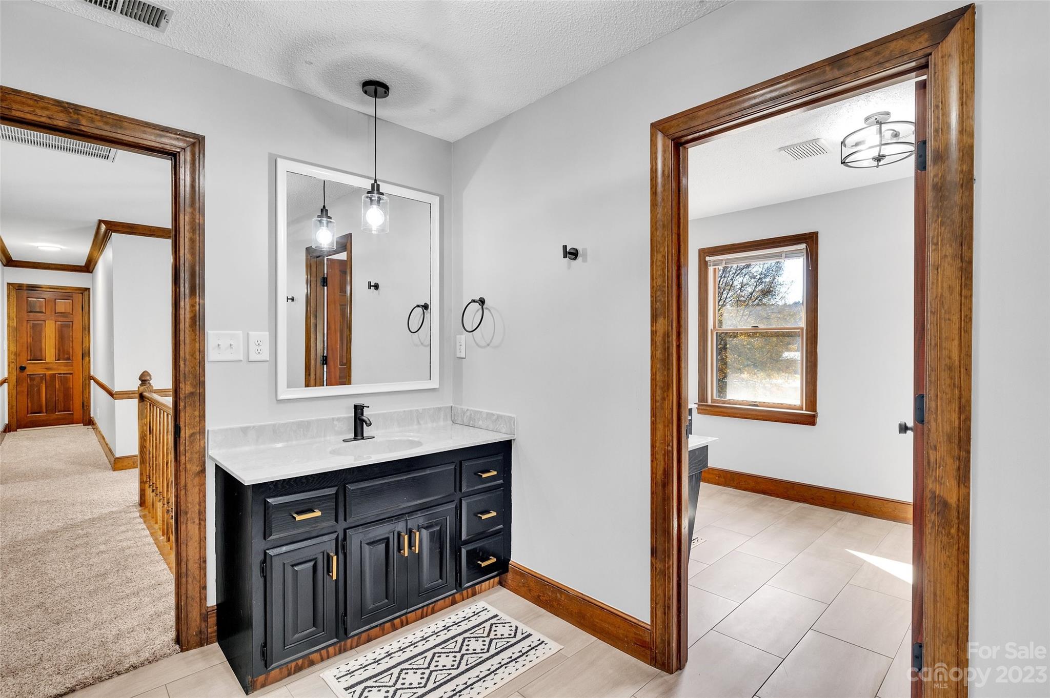 700 West Zion Church Road Shelby, NC 28150 - Photo 30 of 45 a bathroom with a sink a vanity and a mirror