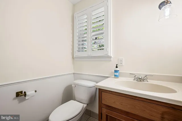 a utility room with cabinets washer and dryer