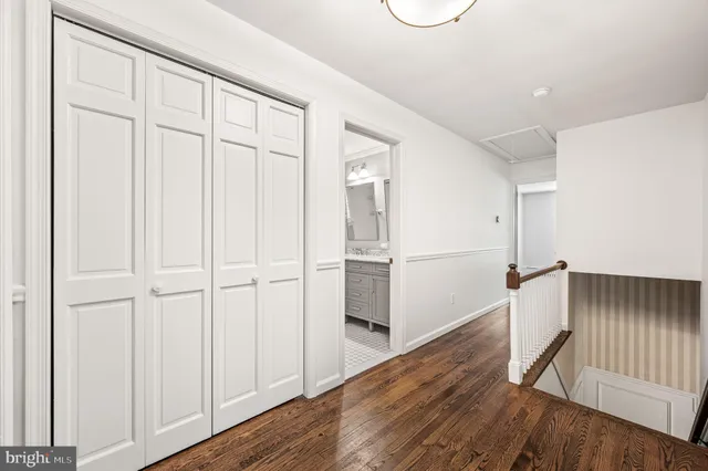 a bathroom with a sink toilet and a mirror