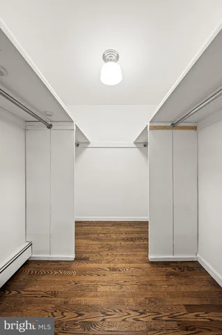 a bathroom with a toilet a sink and shower