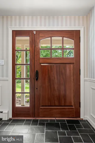 a view of a house with backyard and porch