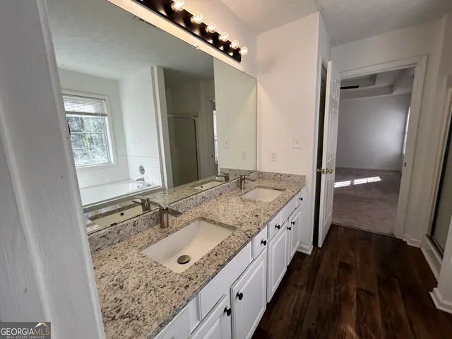 an empty room with windows and closet