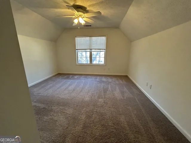 a view of deck and backyard