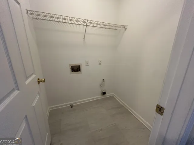 a view of a yard with plants and trees