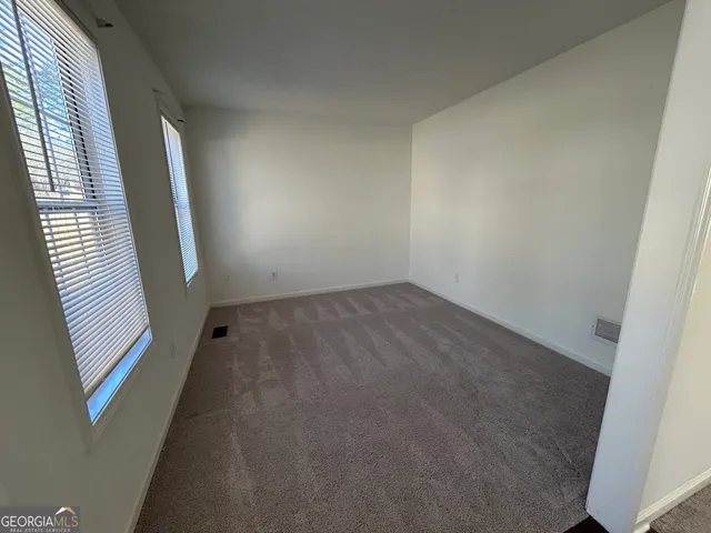 a kitchen with granite countertop a sink a counter space appliances and cabinets