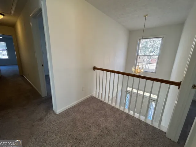 a bathroom with a granite countertop double vanity sink and a mirror
