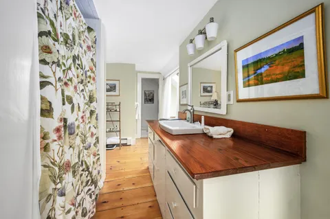 a kitchen with a sink and a refrigerator