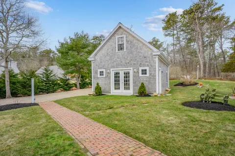 a front view of a house with a yard