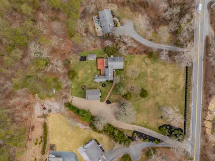 an aerial view of residential house with outdoor space