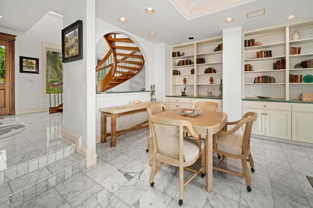 a dining room with furniture and window