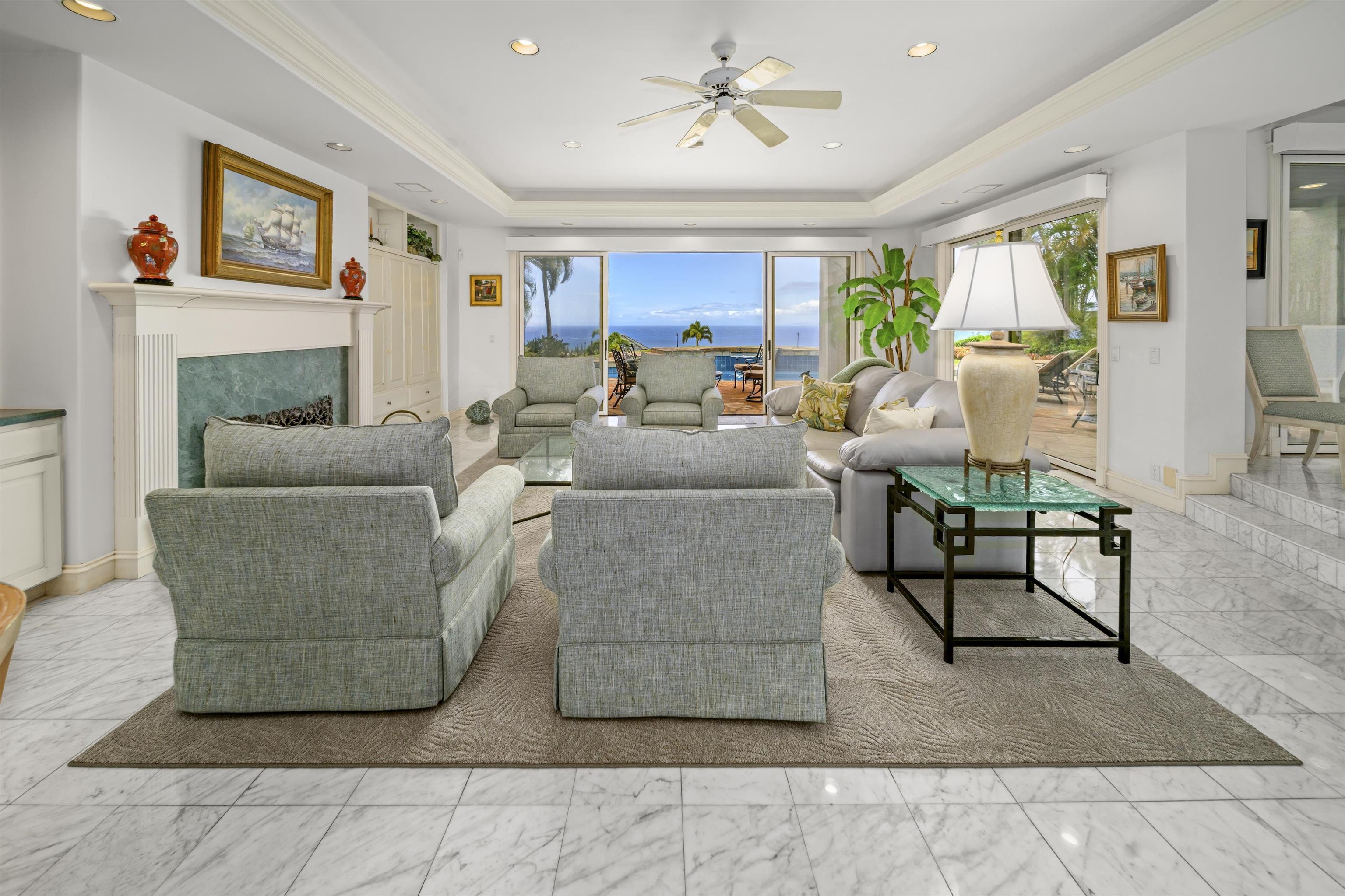 212 Crestview Road Lahaina, HI 96761 - Photo 13 of 50 a living room with furniture a fireplace and a flat screen tv