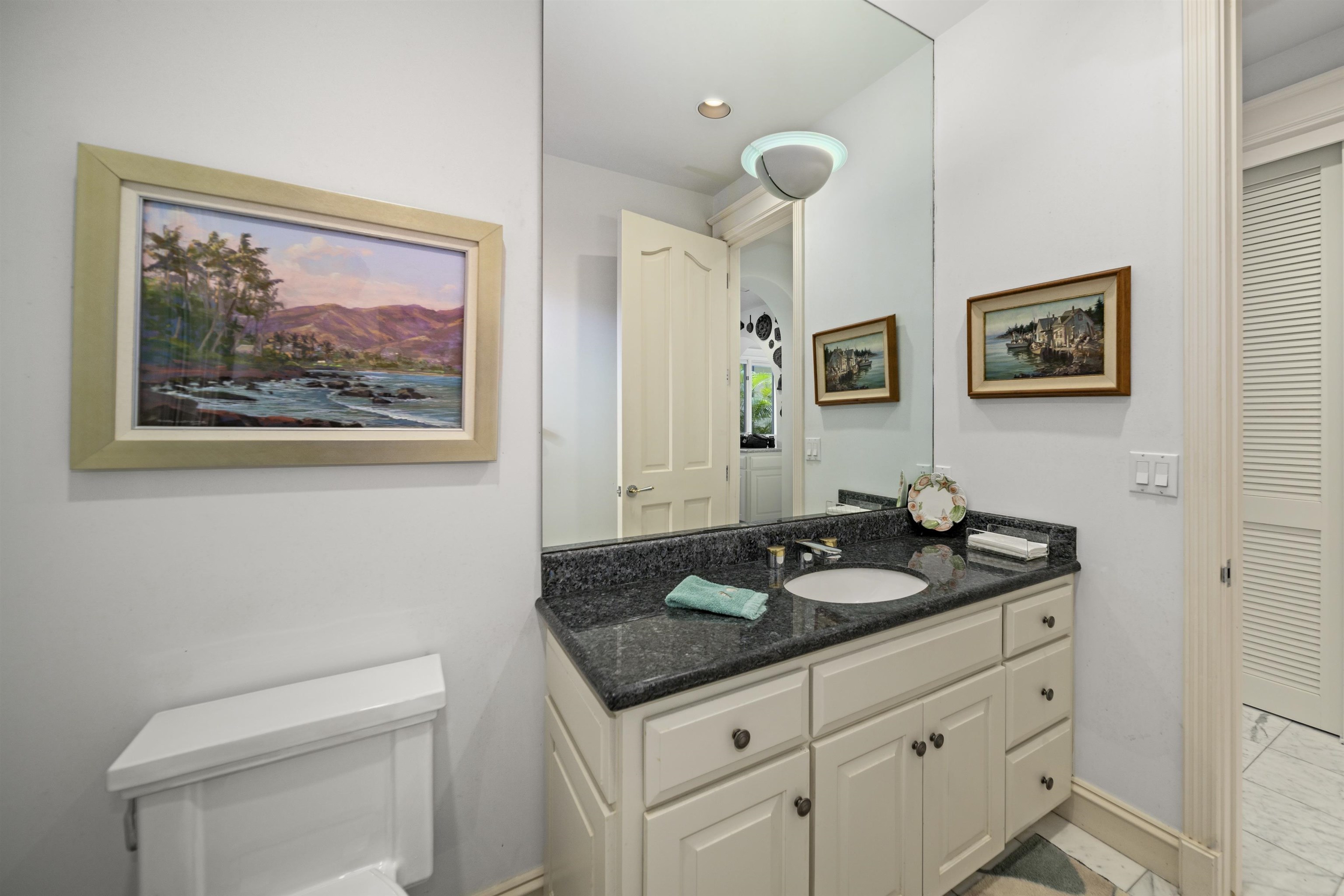 212 Crestview Road Lahaina, HI 96761 - Photo 15 of 50 a bathroom with a granite countertop sink mirror and toilet