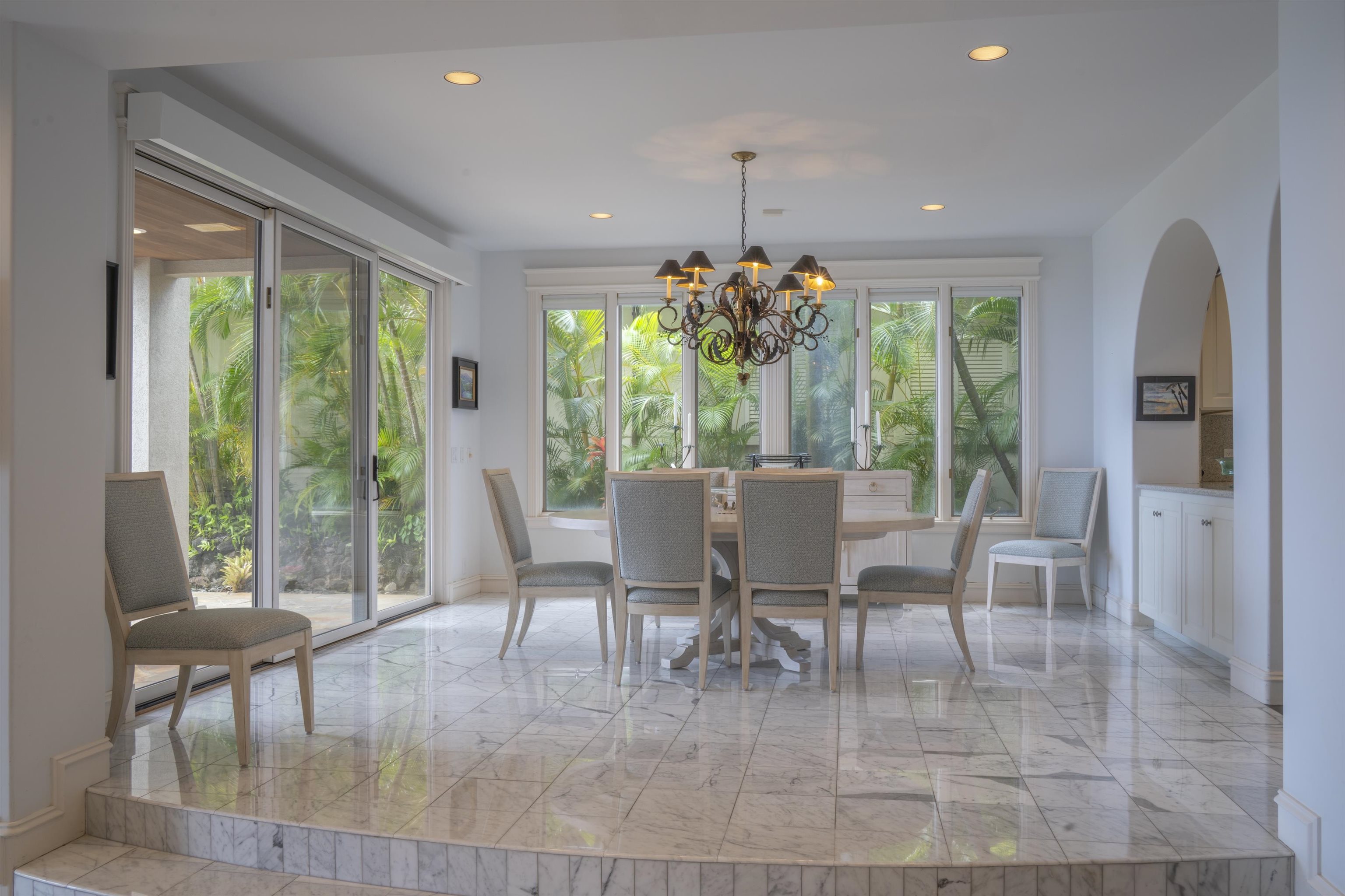 212 Crestview Road Lahaina, HI 96761 - Photo 16 of 50 a dining room with furniture a chandelier and wooden floor